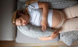 top view pregnant woman using nursing pillow 1